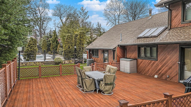 wooden terrace with outdoor dining space