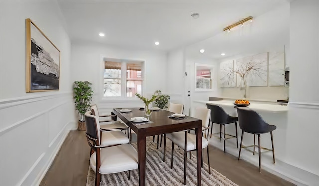 dining area with recessed lighting and wood finished floors