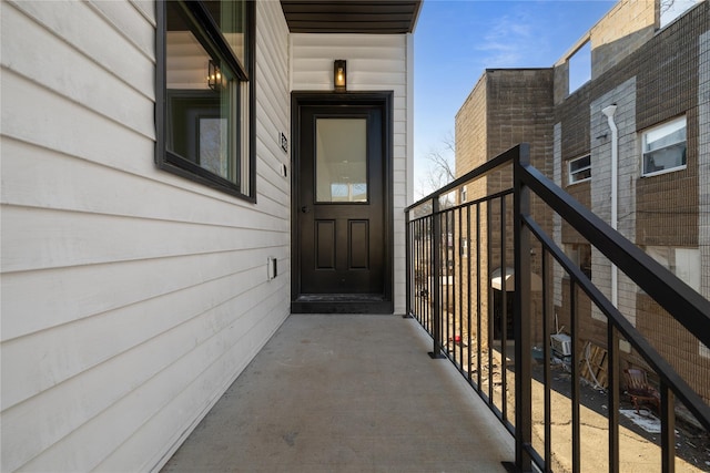 entrance to property featuring a balcony