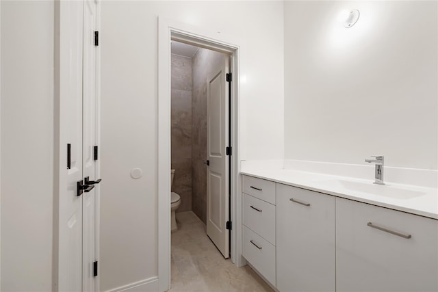 bathroom with toilet and vanity