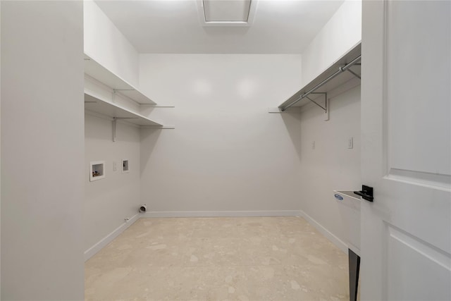 clothes washing area with laundry area, hookup for a washing machine, hookup for a gas dryer, and baseboards