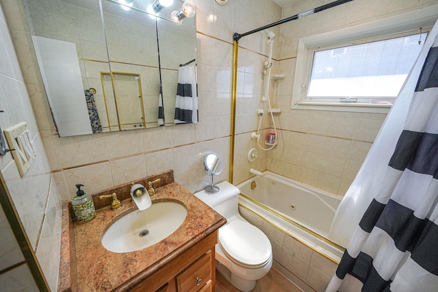 bathroom featuring toilet, vanity, tile walls, tiled shower / bath, and backsplash