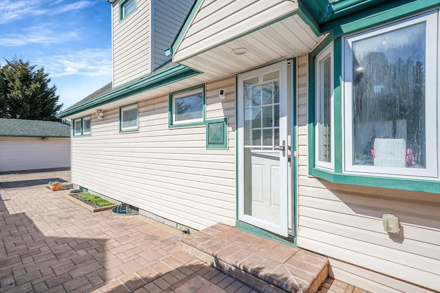 property entrance with a patio area