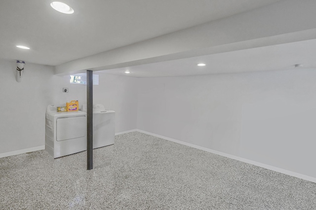 basement featuring recessed lighting, baseboards, and washing machine and clothes dryer