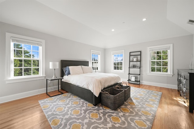 bedroom featuring visible vents, recessed lighting, light wood-type flooring, and baseboards