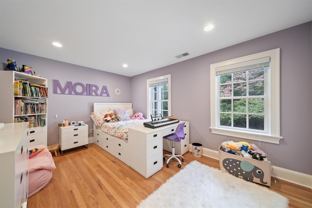 bedroom featuring visible vents, recessed lighting, light wood-type flooring, and baseboards