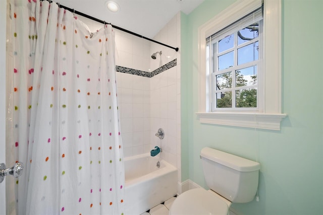 bathroom with toilet and shower / tub combo with curtain