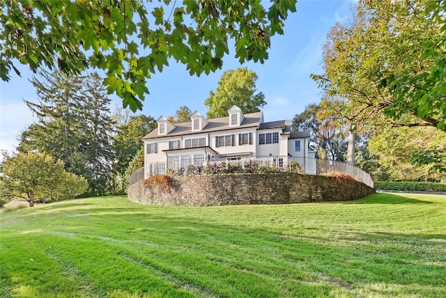 back of house with a yard