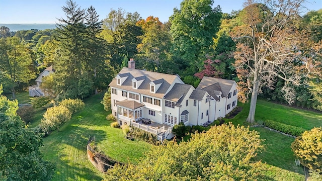 birds eye view of property with a wooded view