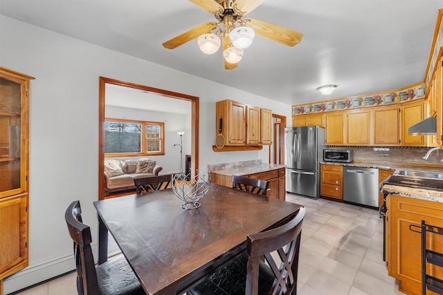 dining area featuring a baseboard radiator and a ceiling fan