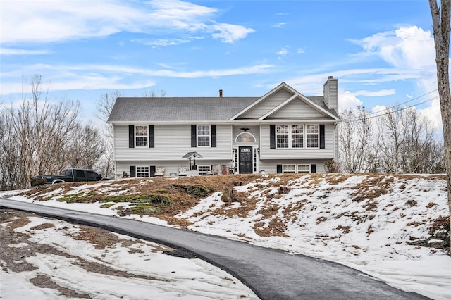 bi-level home with a chimney