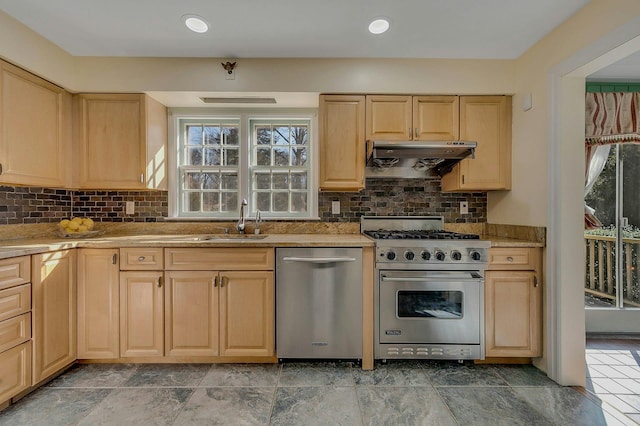 kitchen with tasteful backsplash, stainless steel appliances, light brown cabinetry, under cabinet range hood, and a sink