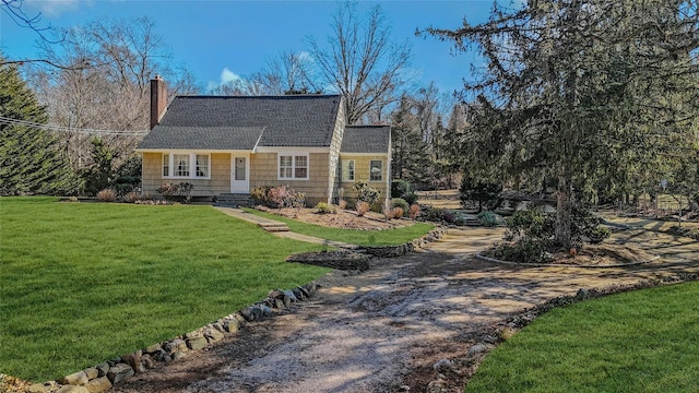 view of front of property with a front lawn and a chimney