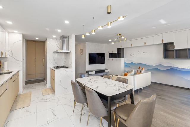 dining area featuring marble finish floor and recessed lighting