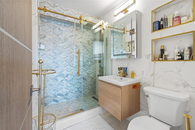 bathroom with marble finish floor, a shower stall, toilet, and vanity