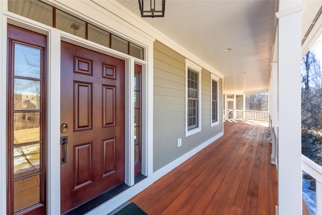 doorway to property featuring covered porch