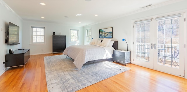 bedroom with light wood finished floors, access to outside, visible vents, and crown molding