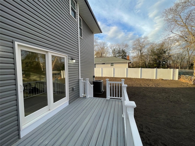 wooden terrace with fence and central AC unit