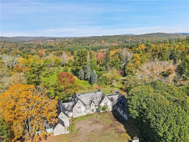 birds eye view of property featuring a wooded view