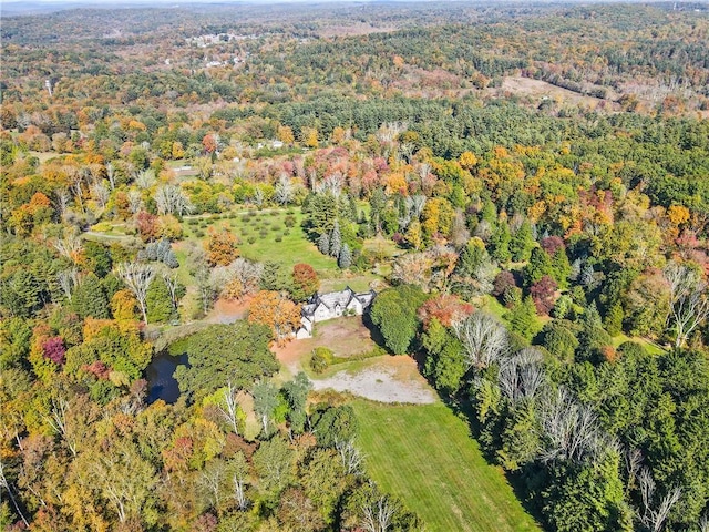 birds eye view of property with a wooded view