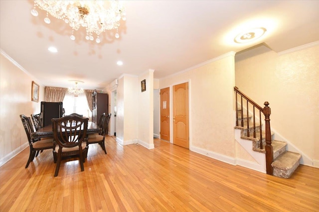 dining area with baseboards, stairs, light wood-type flooring, ornamental molding, and an inviting chandelier