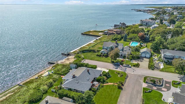 drone / aerial view featuring a water view and a residential view