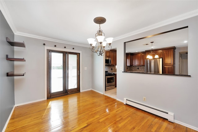 interior space with baseboard heating, light wood-type flooring, and crown molding