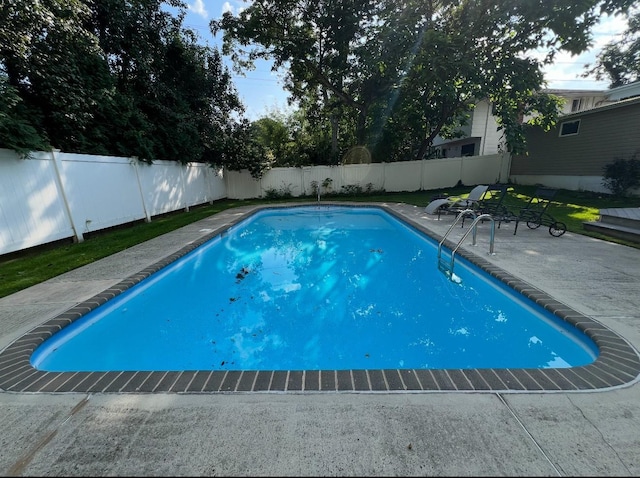 view of swimming pool with a fenced in pool, a patio area, and a fenced backyard