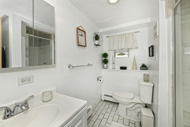 bathroom featuring a stall shower, toilet, baseboard heating, a textured ceiling, and vanity