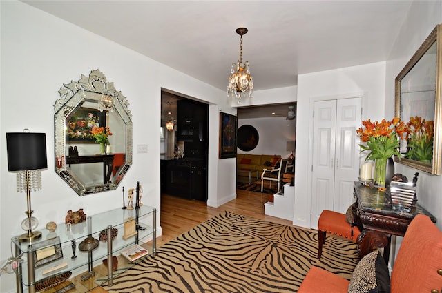 interior space with a chandelier and wood finished floors