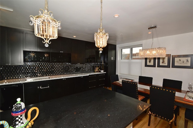 interior space featuring a notable chandelier and wood finished floors