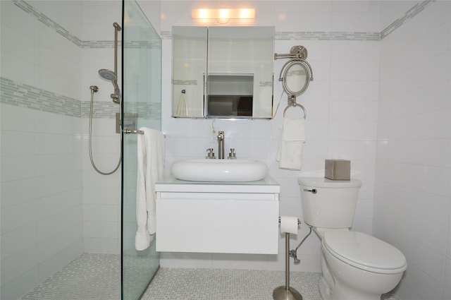 full bath featuring toilet, vanity, tile walls, backsplash, and walk in shower