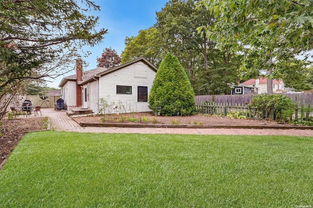 exterior space featuring fence and a patio