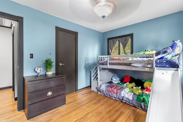 bedroom with wood finished floors and a ceiling fan