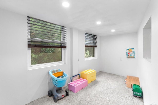 recreation room featuring carpet flooring and recessed lighting