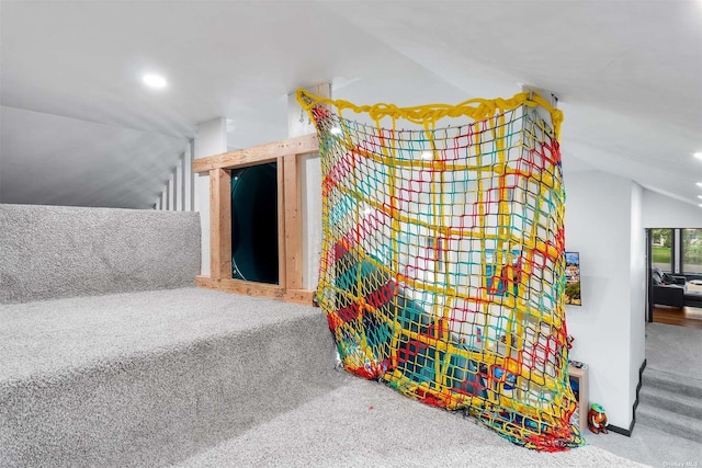 interior space with vaulted ceiling, carpet, and recessed lighting