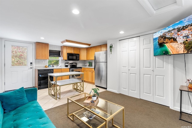 living room with recessed lighting, light carpet, and light tile patterned floors