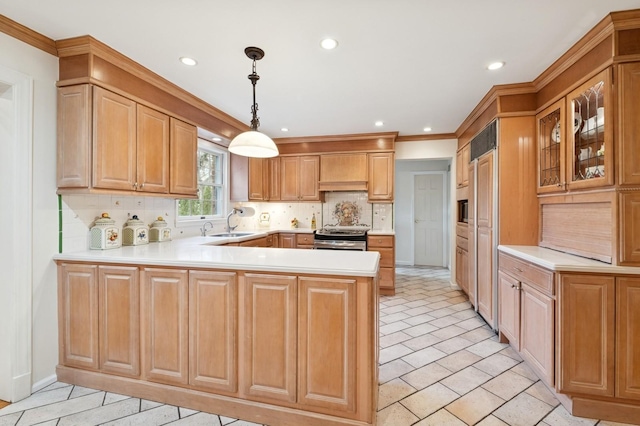 kitchen with decorative backsplash, light countertops, electric range, and a peninsula