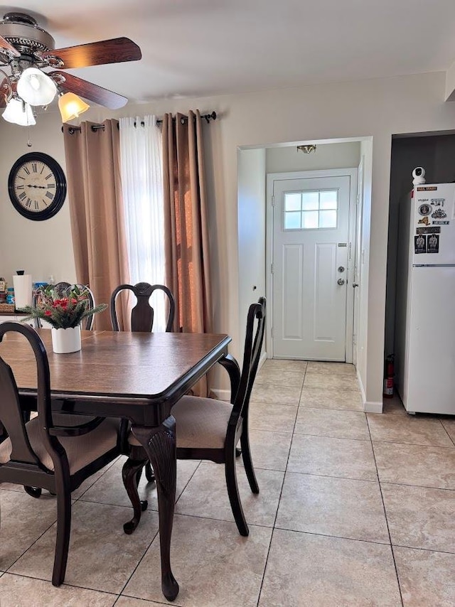 dining area featuring light tile patterned floors