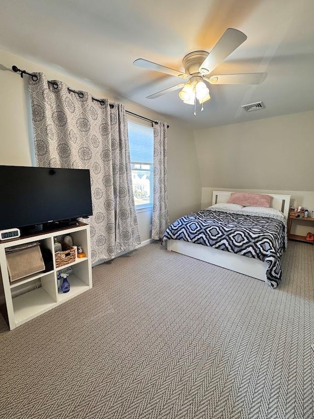 carpeted bedroom featuring visible vents and ceiling fan