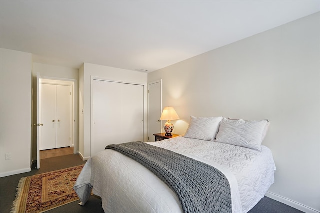 bedroom with a closet and baseboards