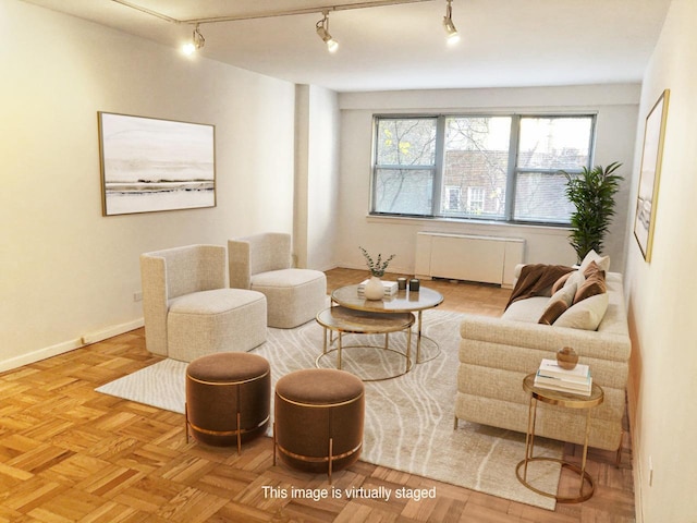 living area with radiator heating unit and baseboards