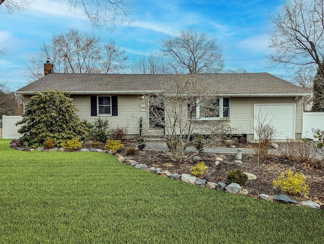 ranch-style house with a chimney, a shingled roof, a front yard, fence, and a garage