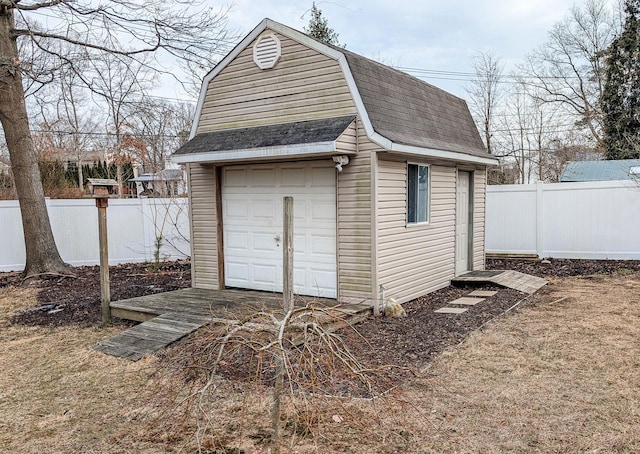 view of outbuilding with a fenced backyard and an outdoor structure