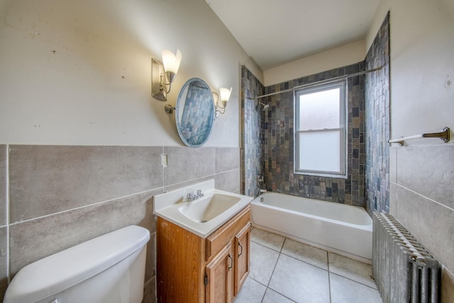 full bathroom with bathtub / shower combination, toilet, tile patterned flooring, tile walls, and radiator heating unit