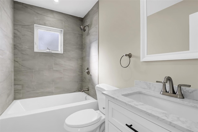 bathroom with shower / bathing tub combination, vanity, and toilet