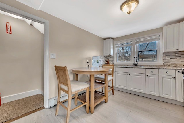 dining space with baseboards