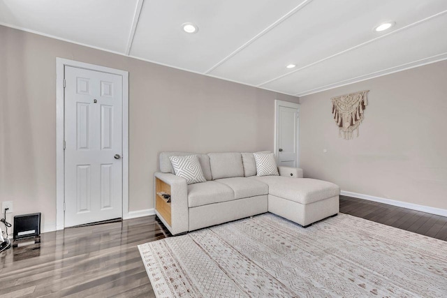 living room with baseboards, wood finished floors, and recessed lighting