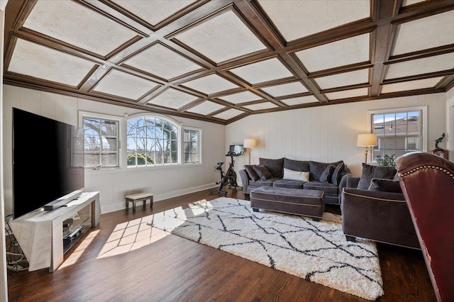 living room with coffered ceiling, baseboards, and wood finished floors