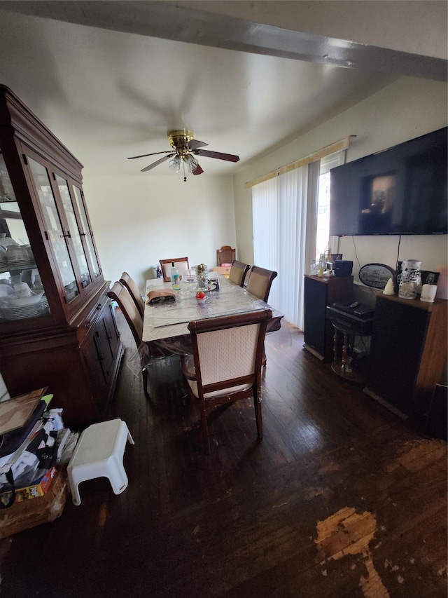 dining space with a ceiling fan and hardwood / wood-style floors